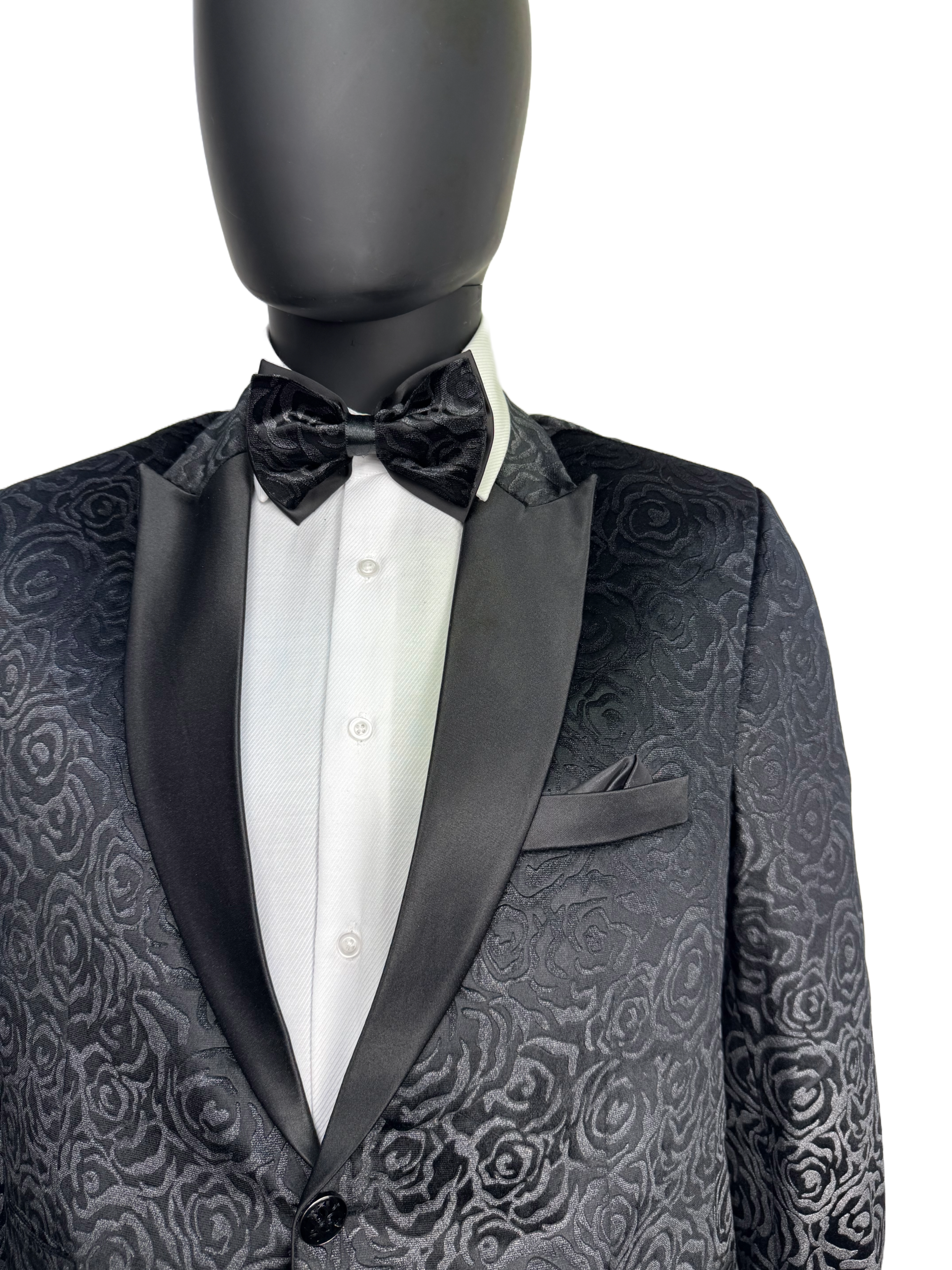 Black tuxedo with floral pattern on a mannequin against a white background.