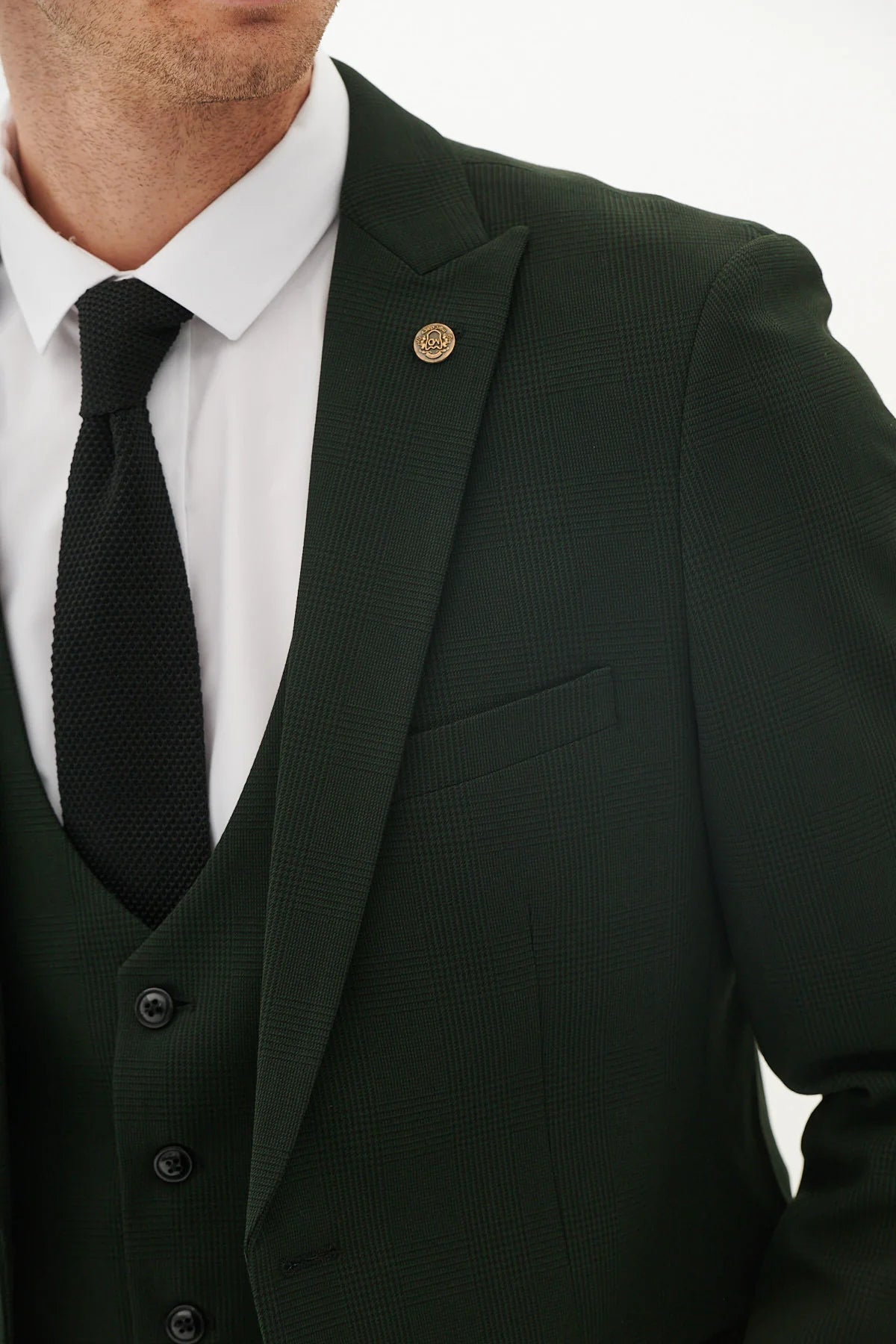 A pair of marine navy check trousers with a Prince of Wales style check pattern, featuring tan buttons and a slim fit.