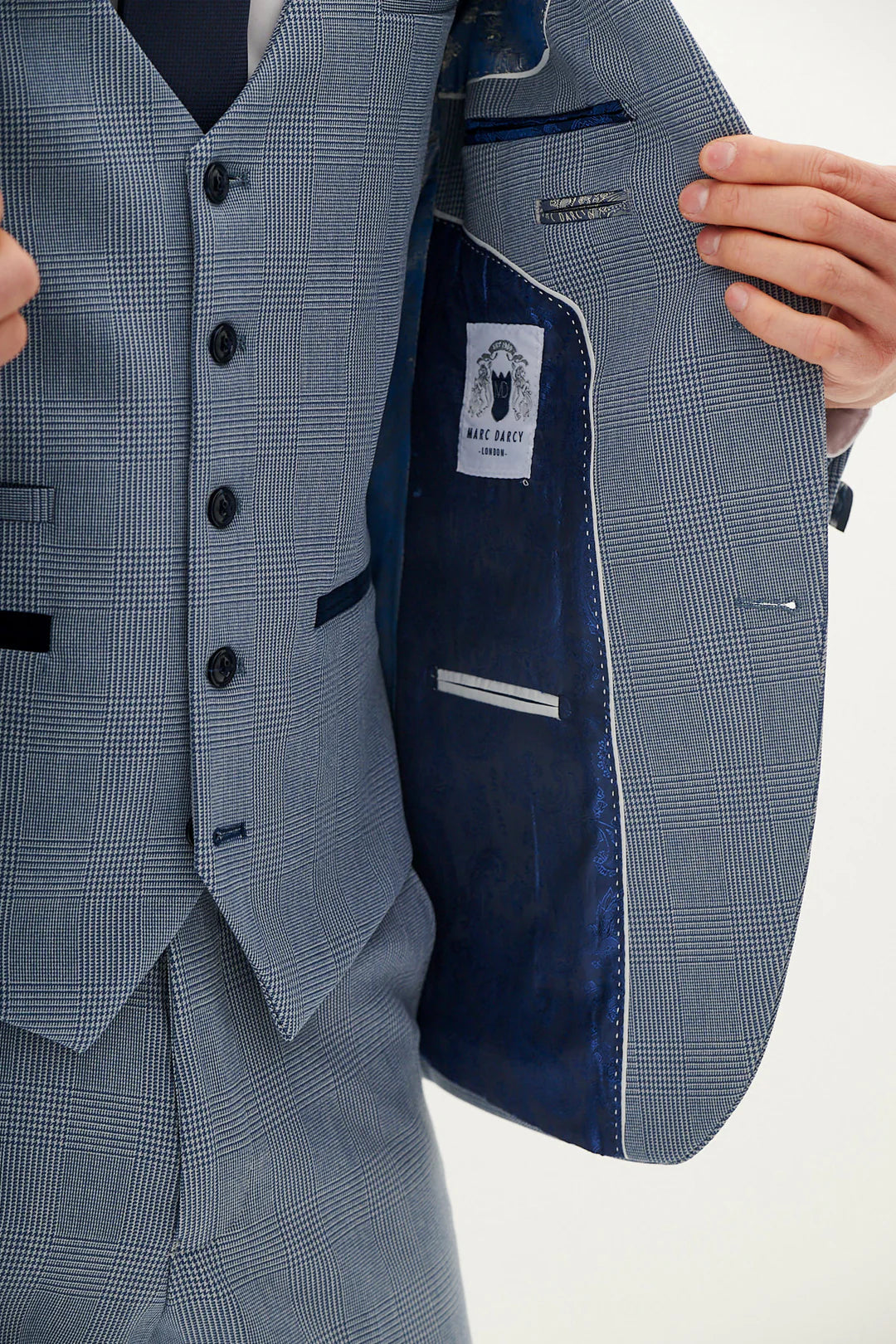 Close-up of a gray suit with a label visible.
