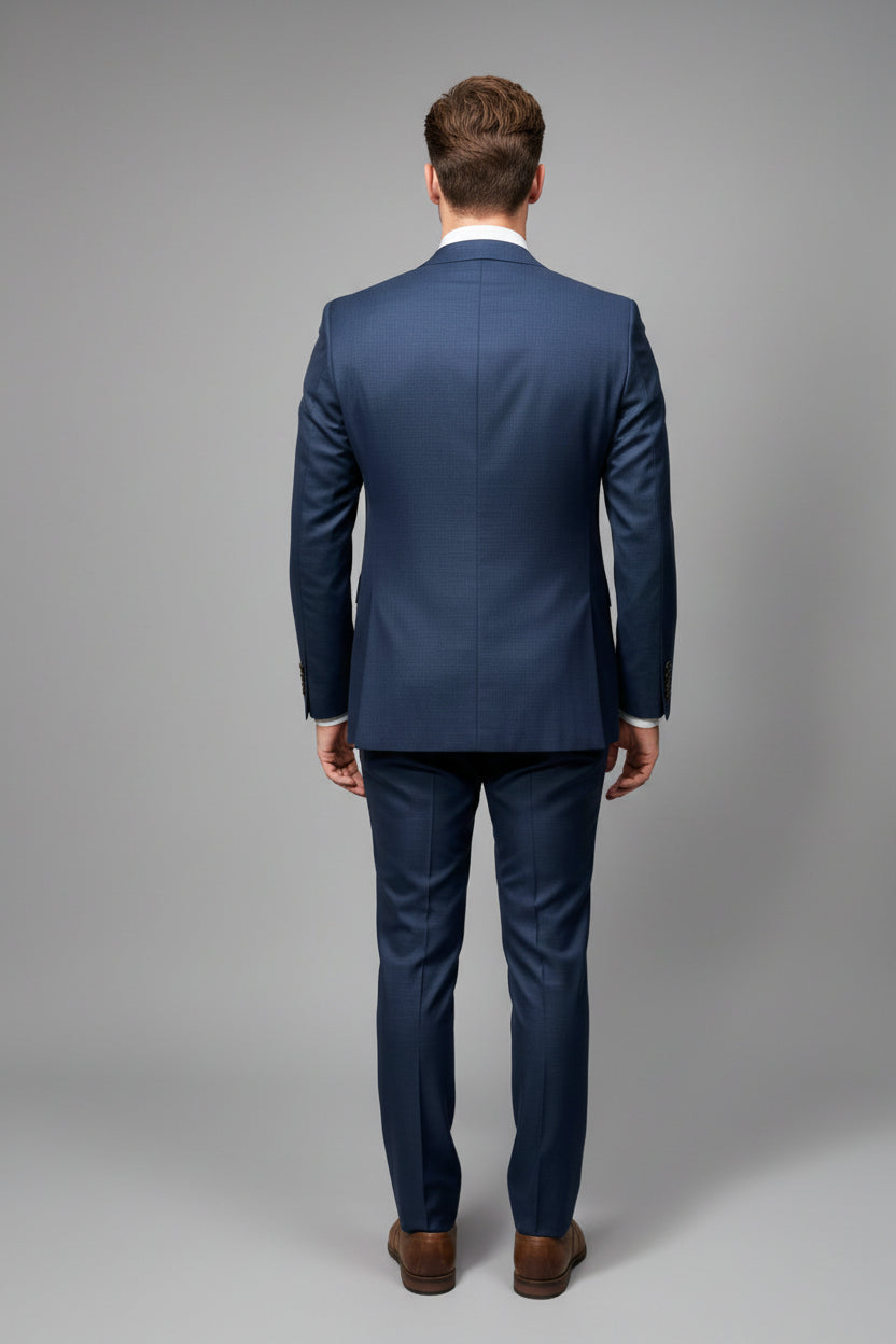 Navy blue suit on a mannequin against a gray background
