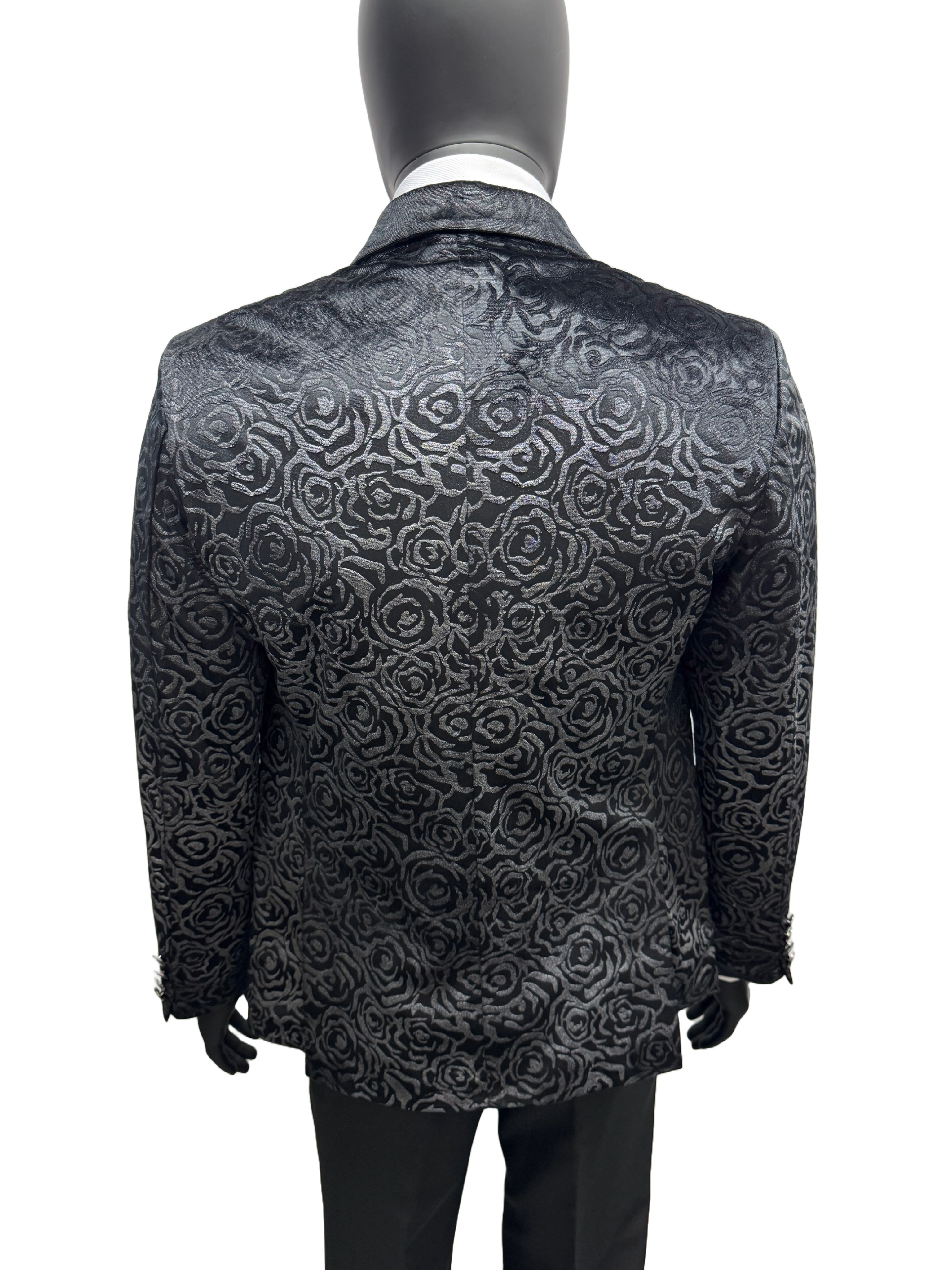 Mannequin wearing a black and gray patterned jacket on a white background