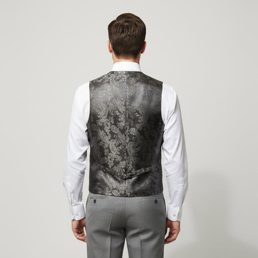Mannequin wearing a silver vest and pants set on a white background