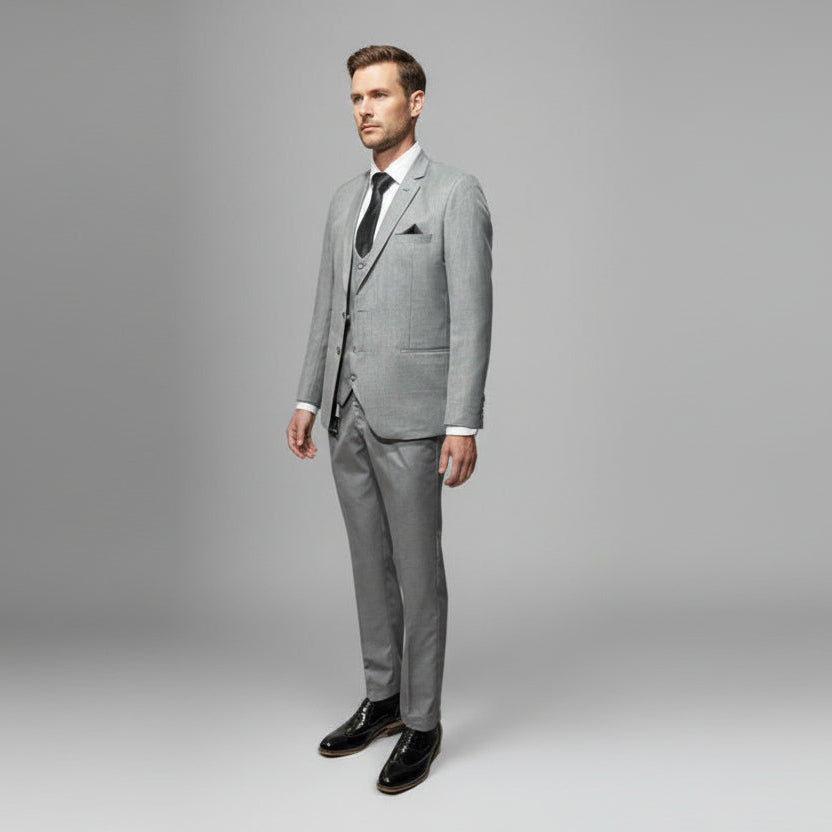 Gray suit on a mannequin against a plain background