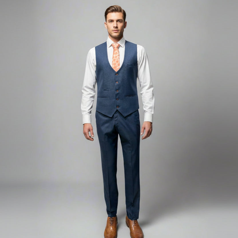 Navy blue suit with a white shirt and brown shoes on a gray background
