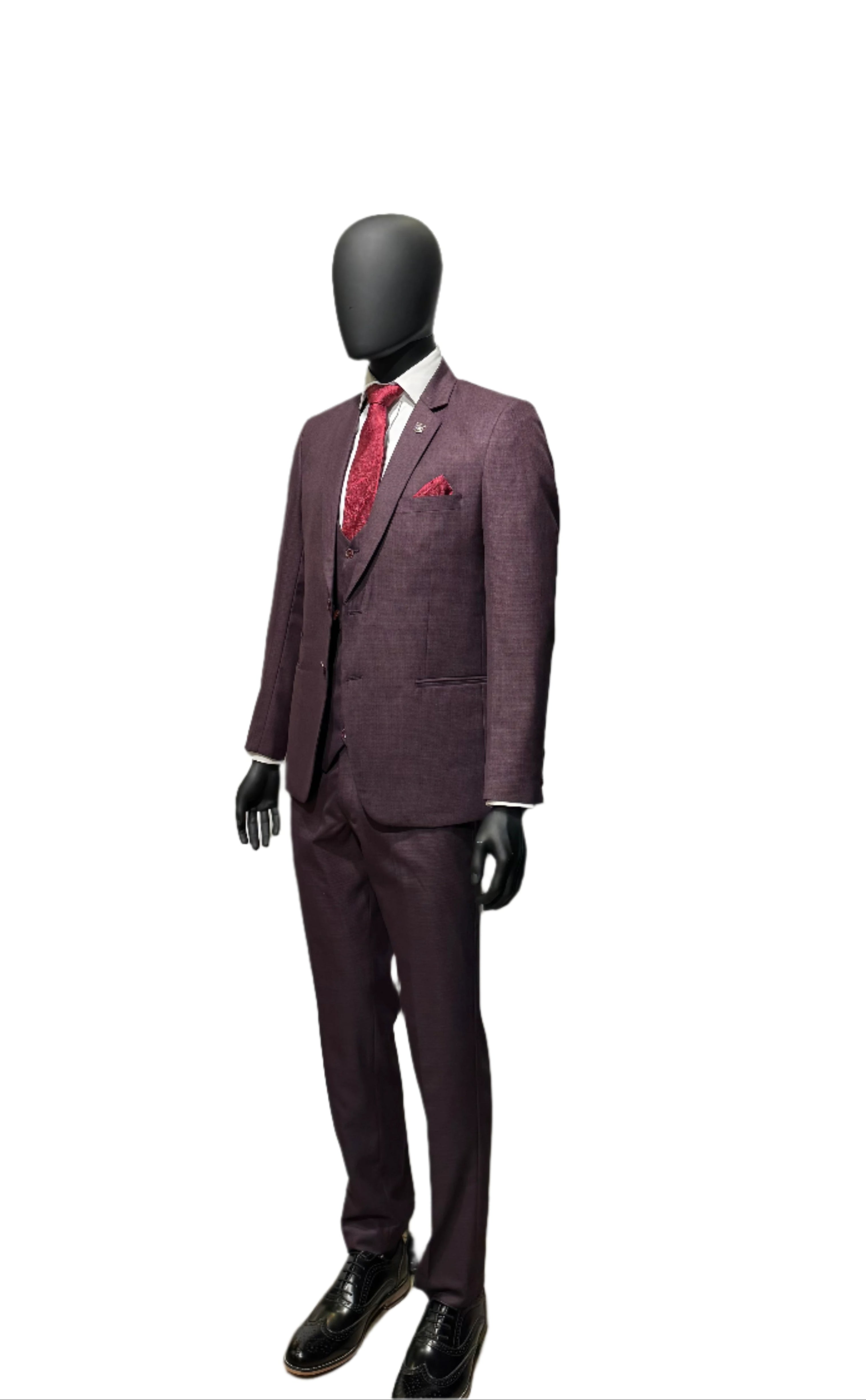 Purple suit on a mannequin with a red tie against a white background