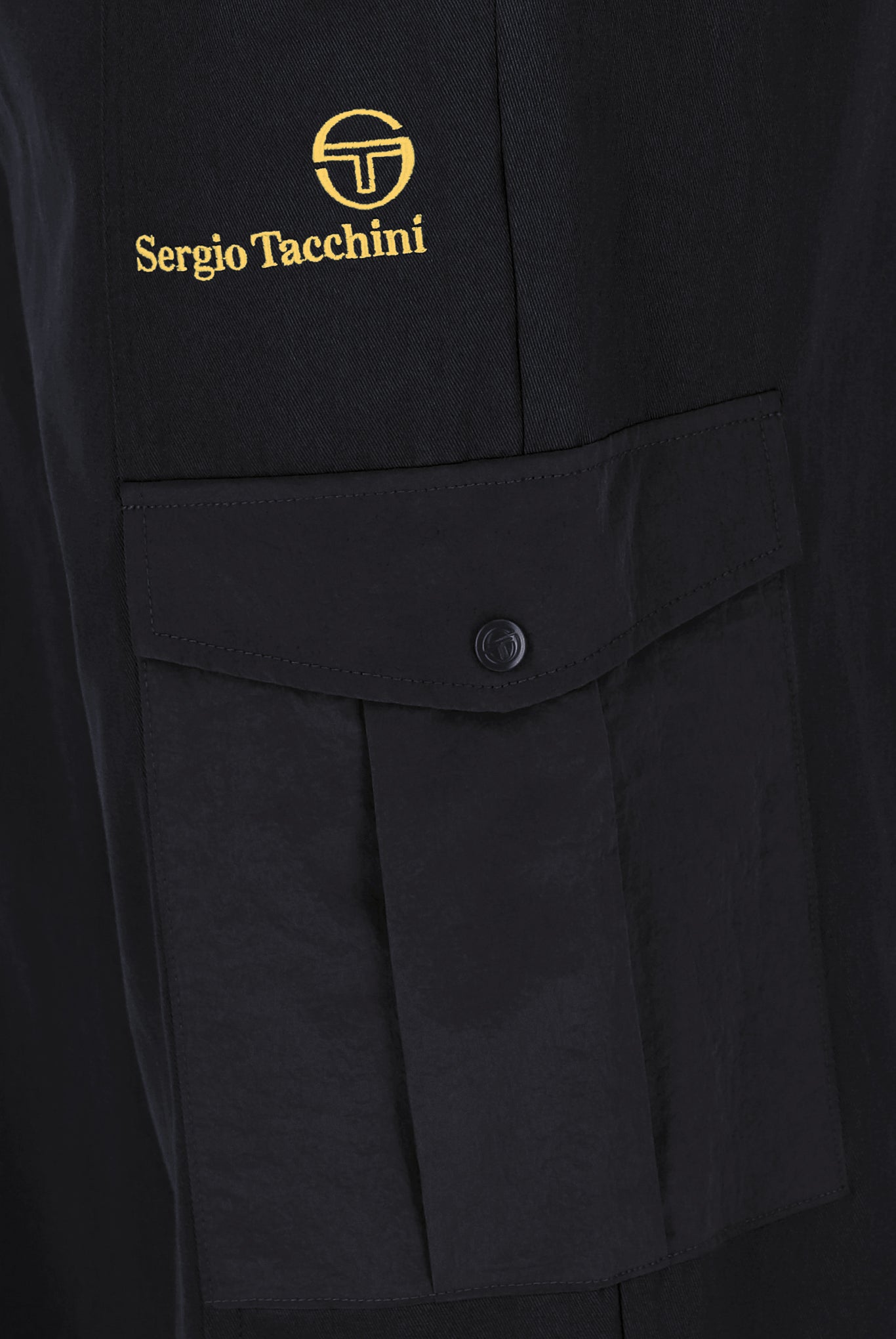 A pair of Sergio Tacchini Antonio Cargo Pants in black, displaying the front view with crinkle nylon cargo pockets and adjustable cuffs.