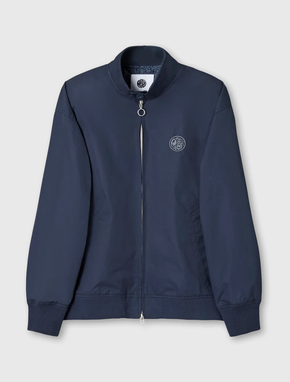 Navy blue jacket with a brand logo on a light gray background