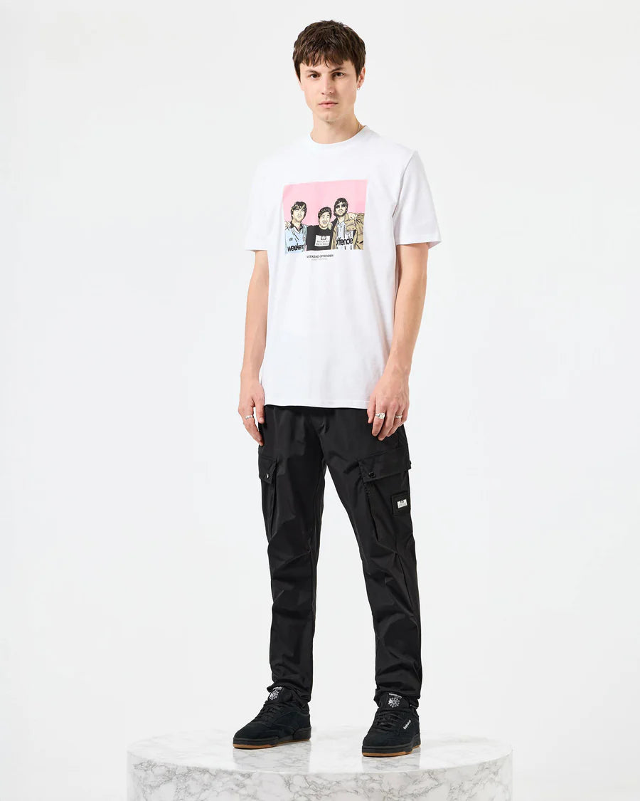 Person wearing a white t-shirt with a graphic design and black cargo pants on a white background