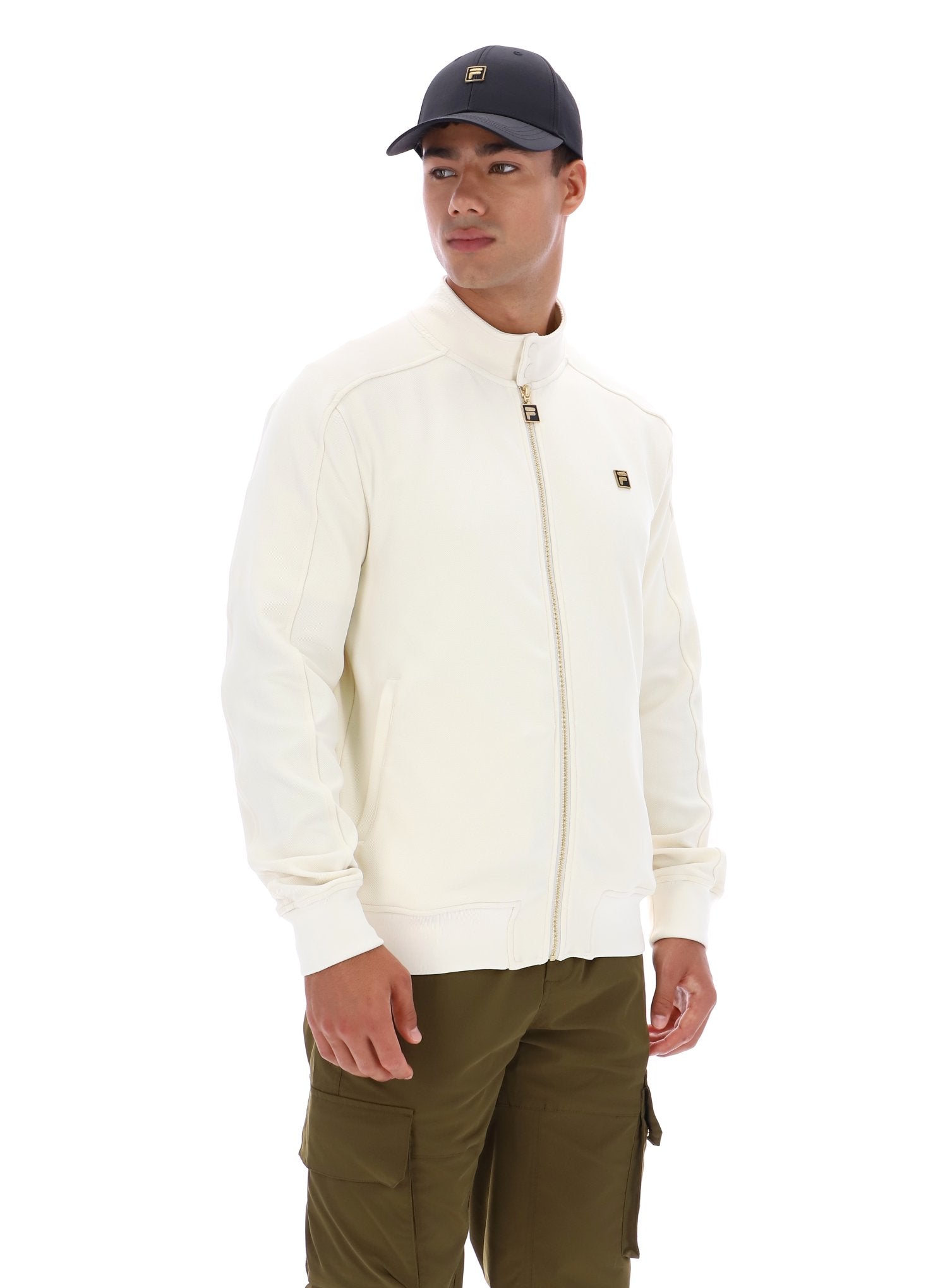 Man wearing a white jacket and green pants on a white background