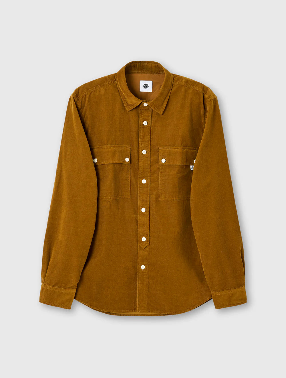 Brown shirt with white buttons on a light gray background