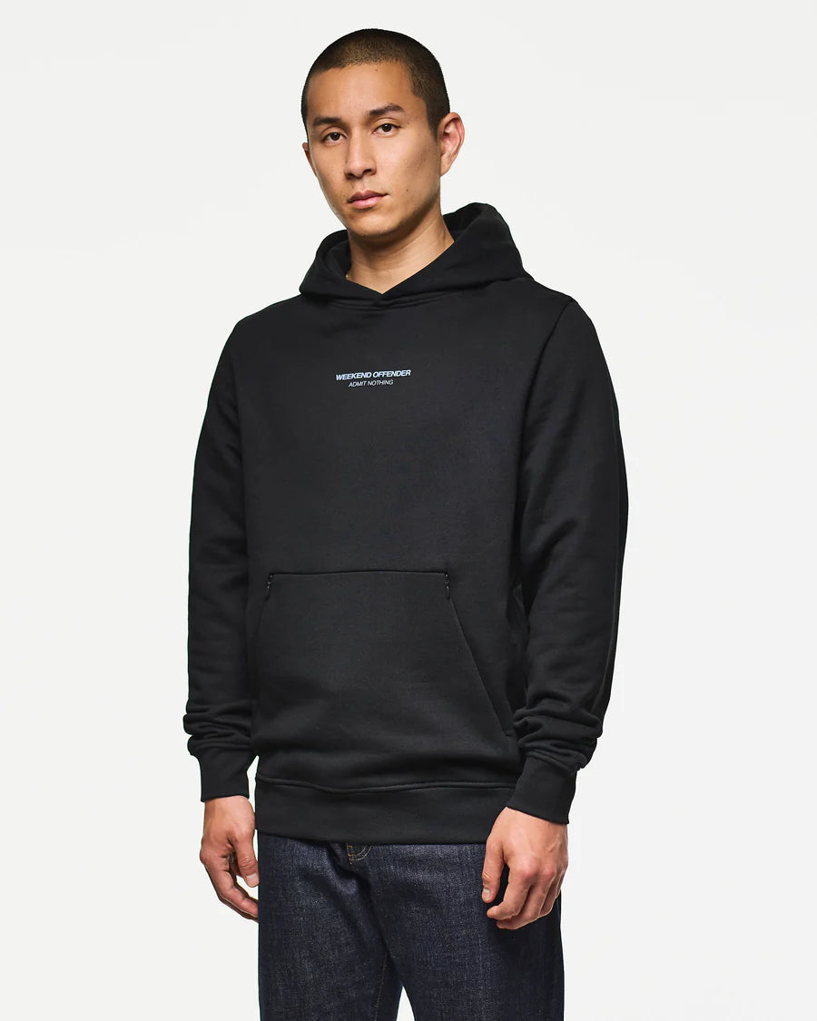 Person wearing a black hoodie with a logo on a white background