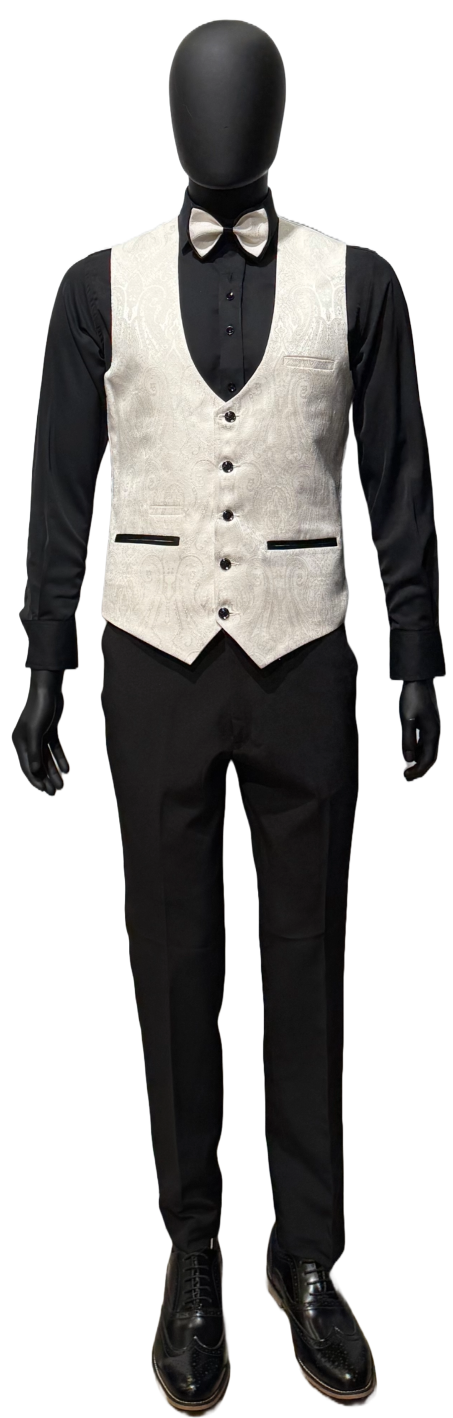 A mannequin wearing a white tuxedo on a white background