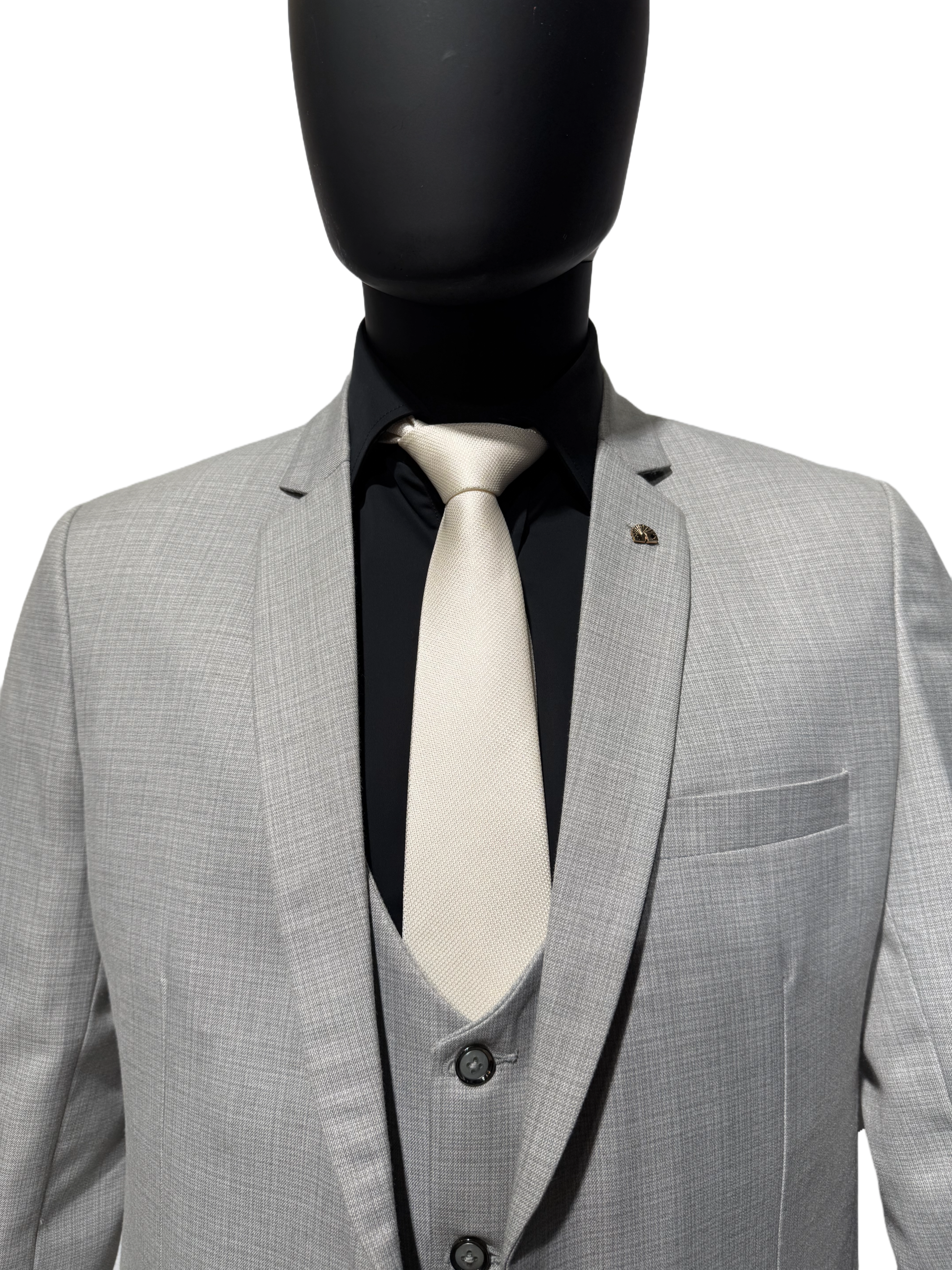 Grey suit on a mannequin against a white background