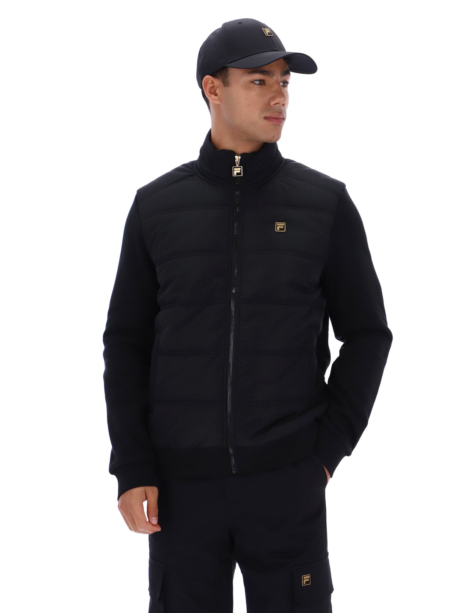 Man wearing a black jacket with a brand logo on a white background