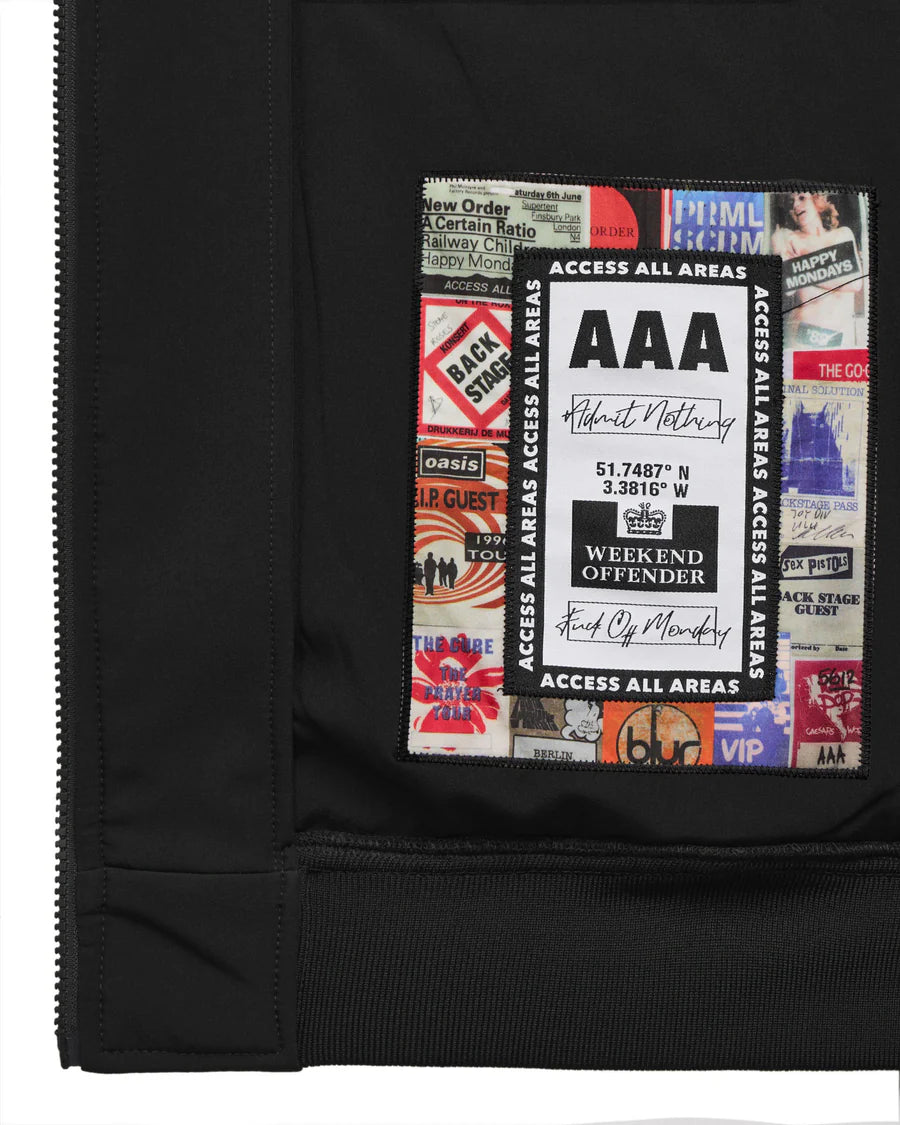 Black jacket with a collage of music album covers and text on the chest pocket.