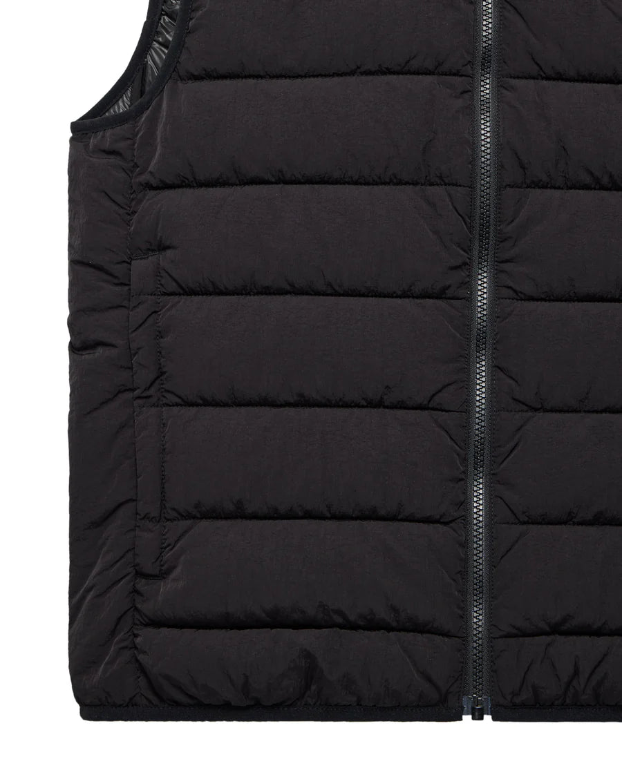 Close-up of a black puffer vest with a zipper on a white background