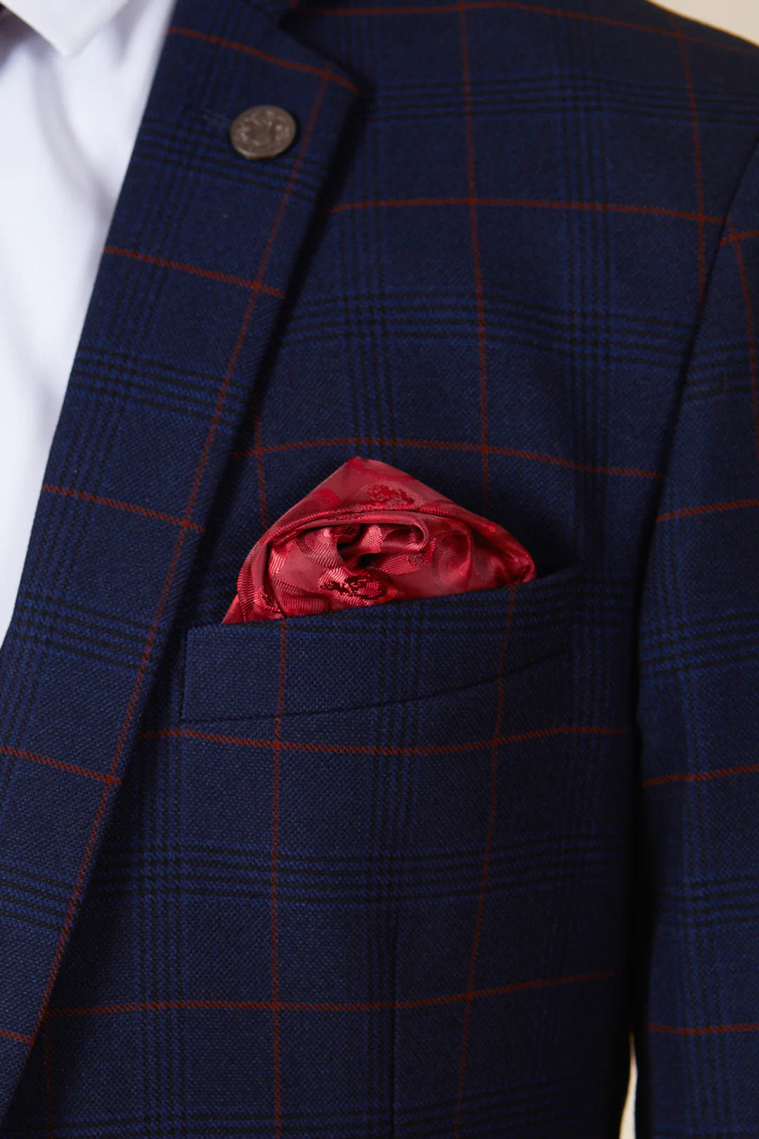 Navy blue checkered blazer with a red pocket square.