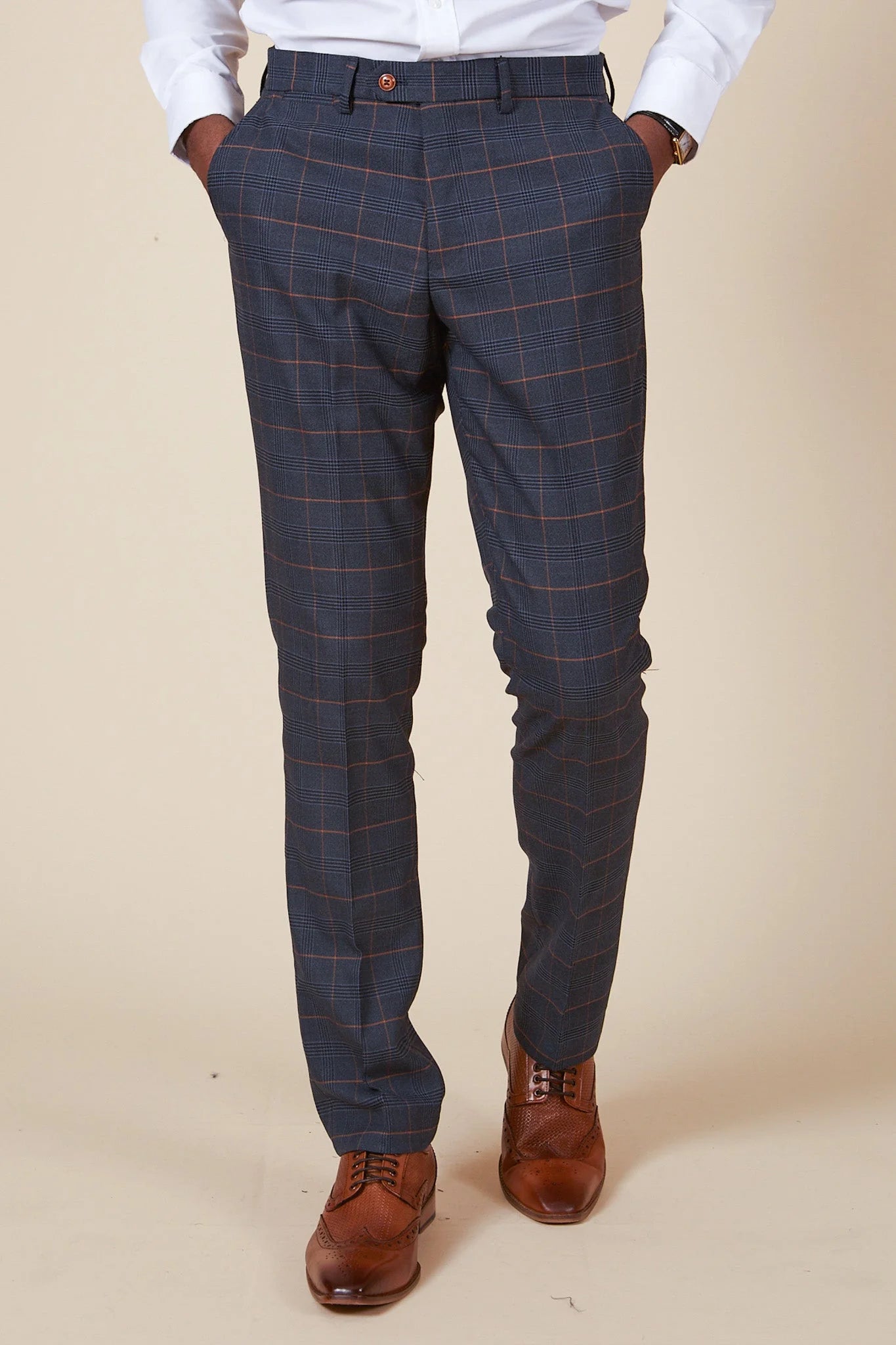 A pair of marine navy check trousers with a Prince of Wales style check pattern, featuring tan buttons and a slim fit.