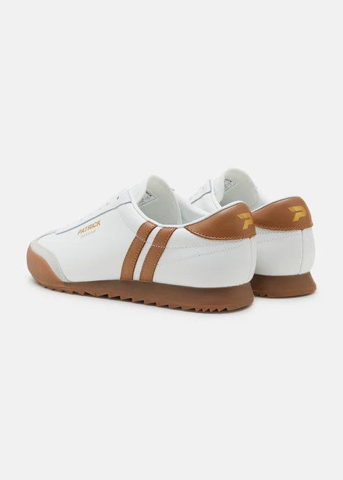 A pair of white Patrick Villan trainers with a lace-up front, rubber outsole, and gold signature logo.