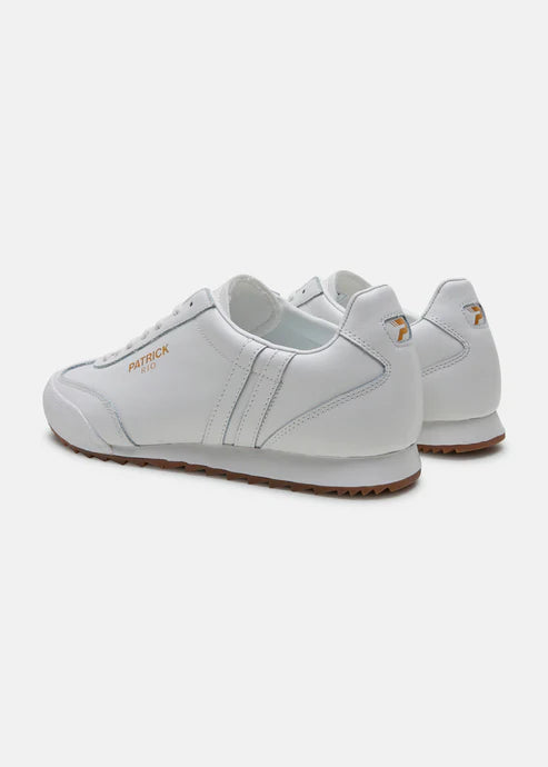 A pair of white Patrick Rio trainer shoes with a suede upper and a rubber sole, featuring a contrast striped panel and a gold foil logo.