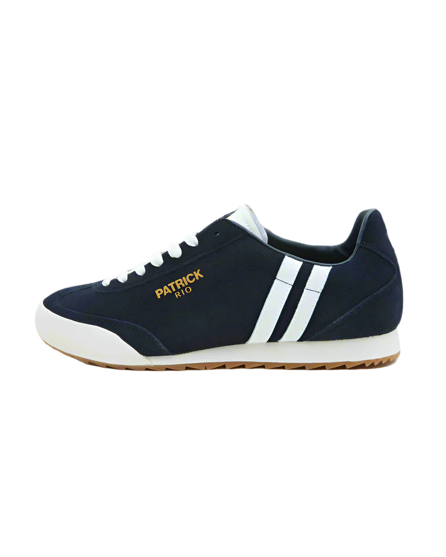 A navy and white Patrick Rio trainer shoe with a suede upper and a rubber sole, featuring a contrast striped panel and a cushioned insole.