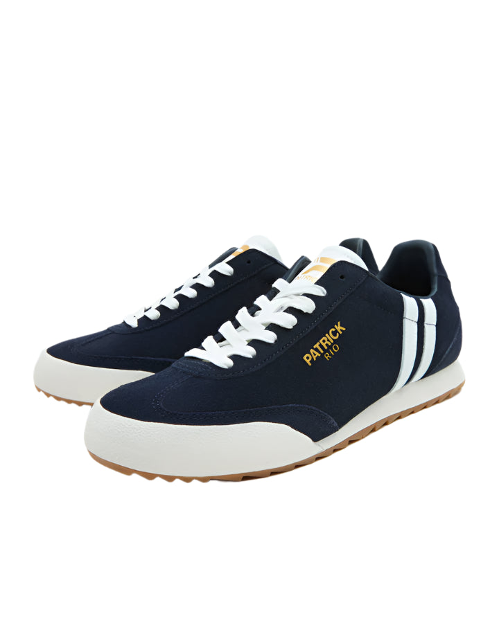 A pair of blue Patrick Villan trainers with a lace-up front, rubber outsole, and gold signature logo.