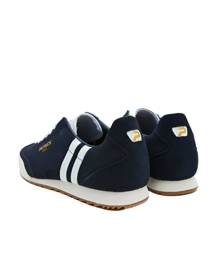 A pair of blue Patrick Villan trainers with a lace-up front, rubber outsole, and gold signature logo.