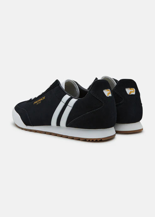 A black and white Patrick Rio trainer shoe with a suede upper and a rubber sole, featuring a contrast striped panel and a gold Patrick logo.