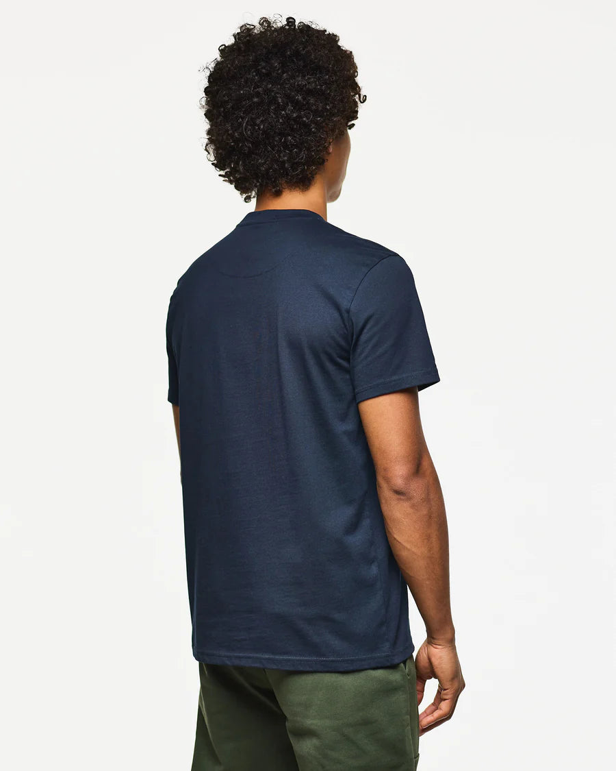 Person wearing a navy blue t-shirt on a white background