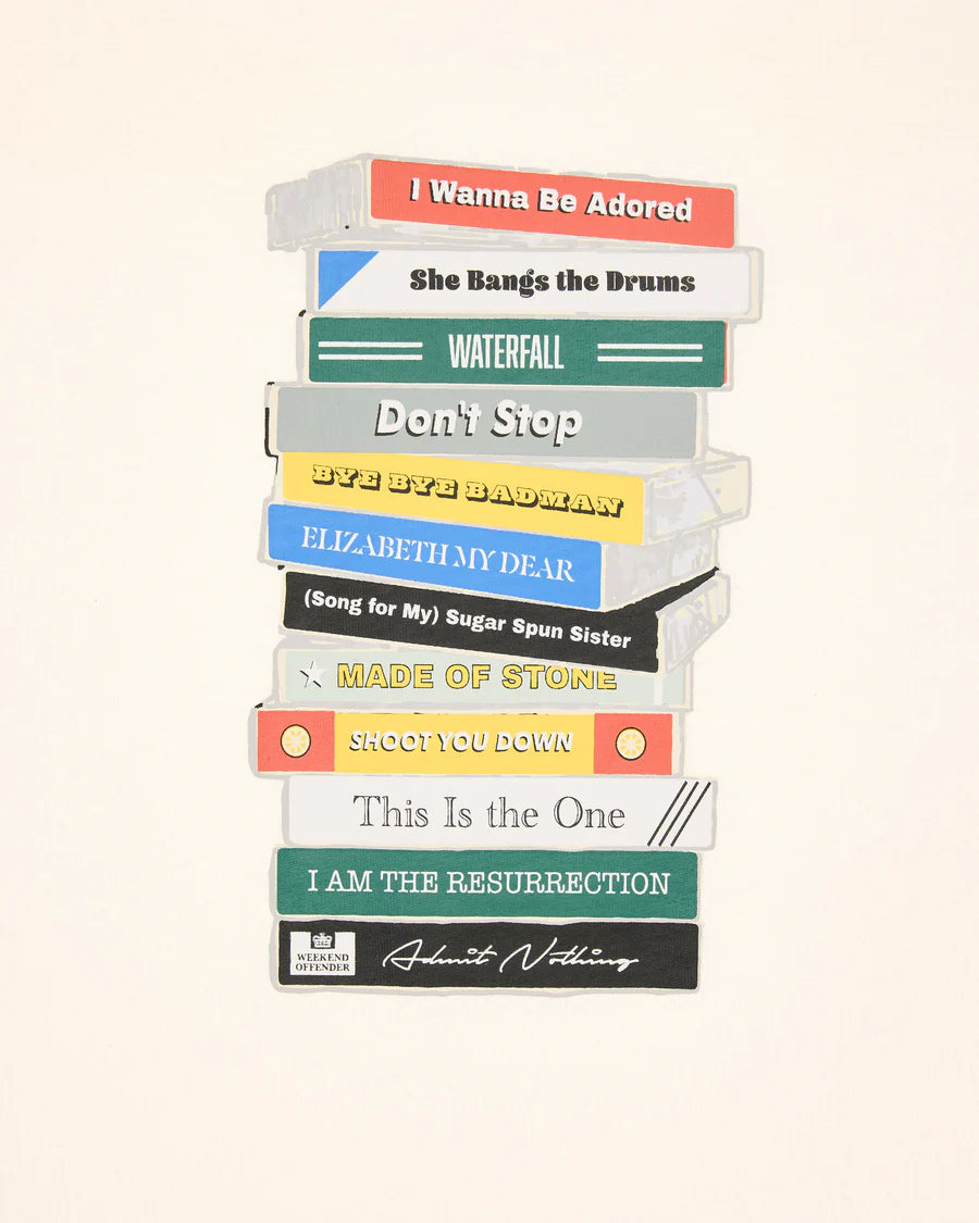 Stack of vinyl records with colorful labels on a white background