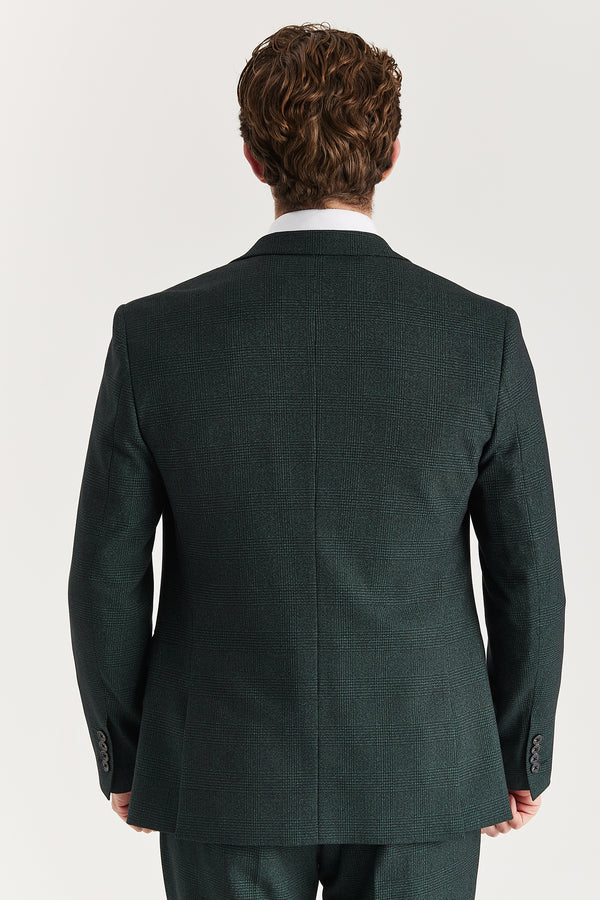 Green suit jacket worn by a person on a white background