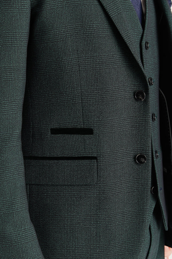 Close-up of a dark green suit jacket with buttons and placket details.