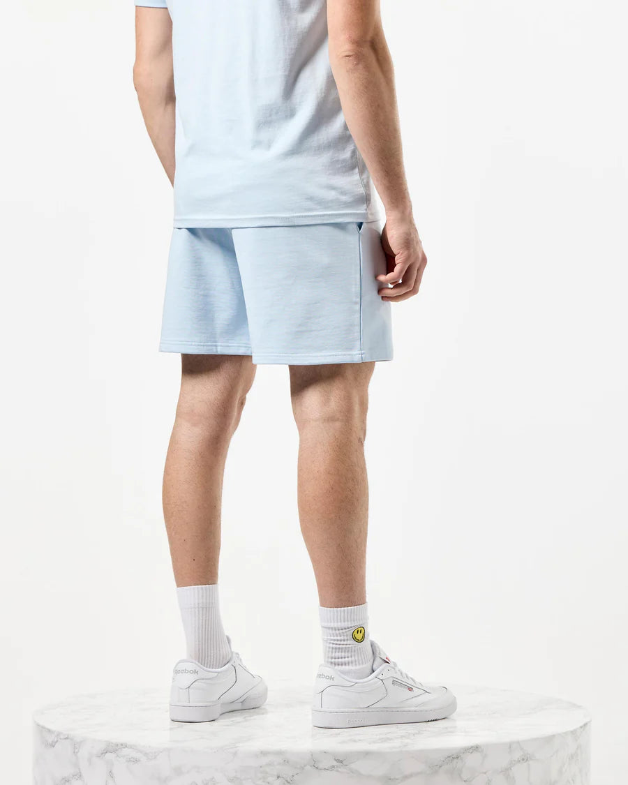 A pair of light blue Weekend Offender Mytros shorts with a high-density print on the leg, featuring angled side entry pockets, a back welt pocket with a concealed press stud fastening, and an elasticated waistband with an external tie cord.