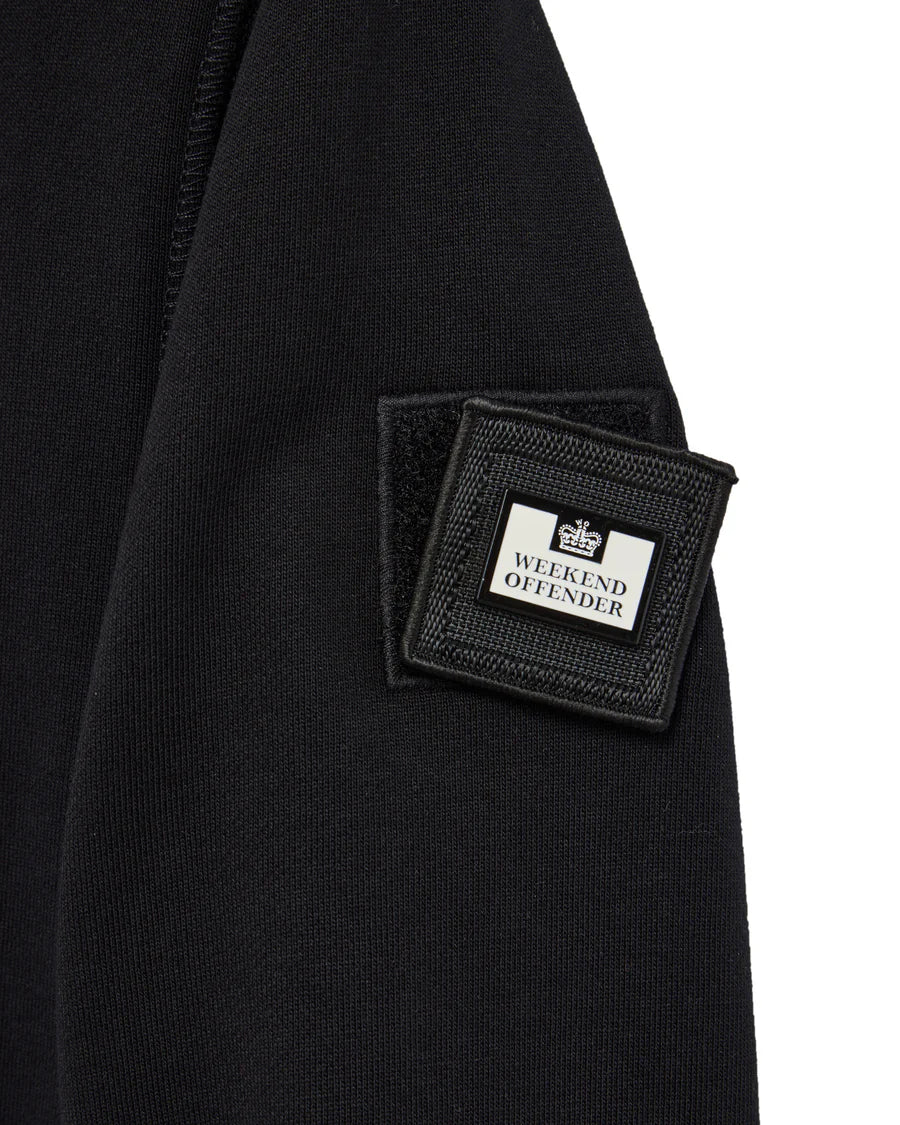 Black jacket with 'Weekend Offender' logo patch on a white background