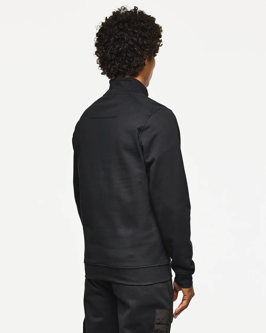 Person wearing a black jacket on a white background