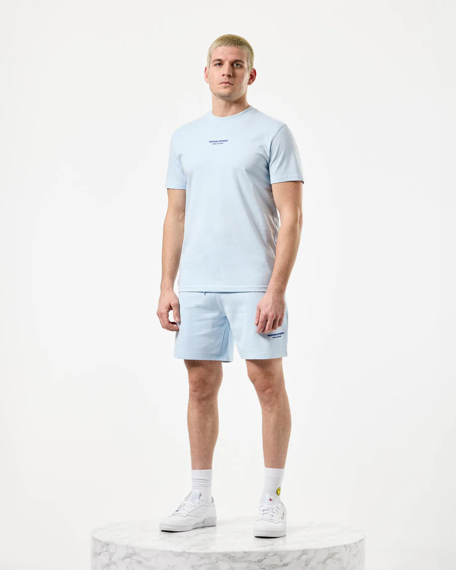 A pair of light blue Weekend Offender Mytros shorts with a high-density print on the leg, featuring angled side entry pockets, a back welt pocket with a concealed press stud fastening, and an elasticated waistband with an external tie cord.