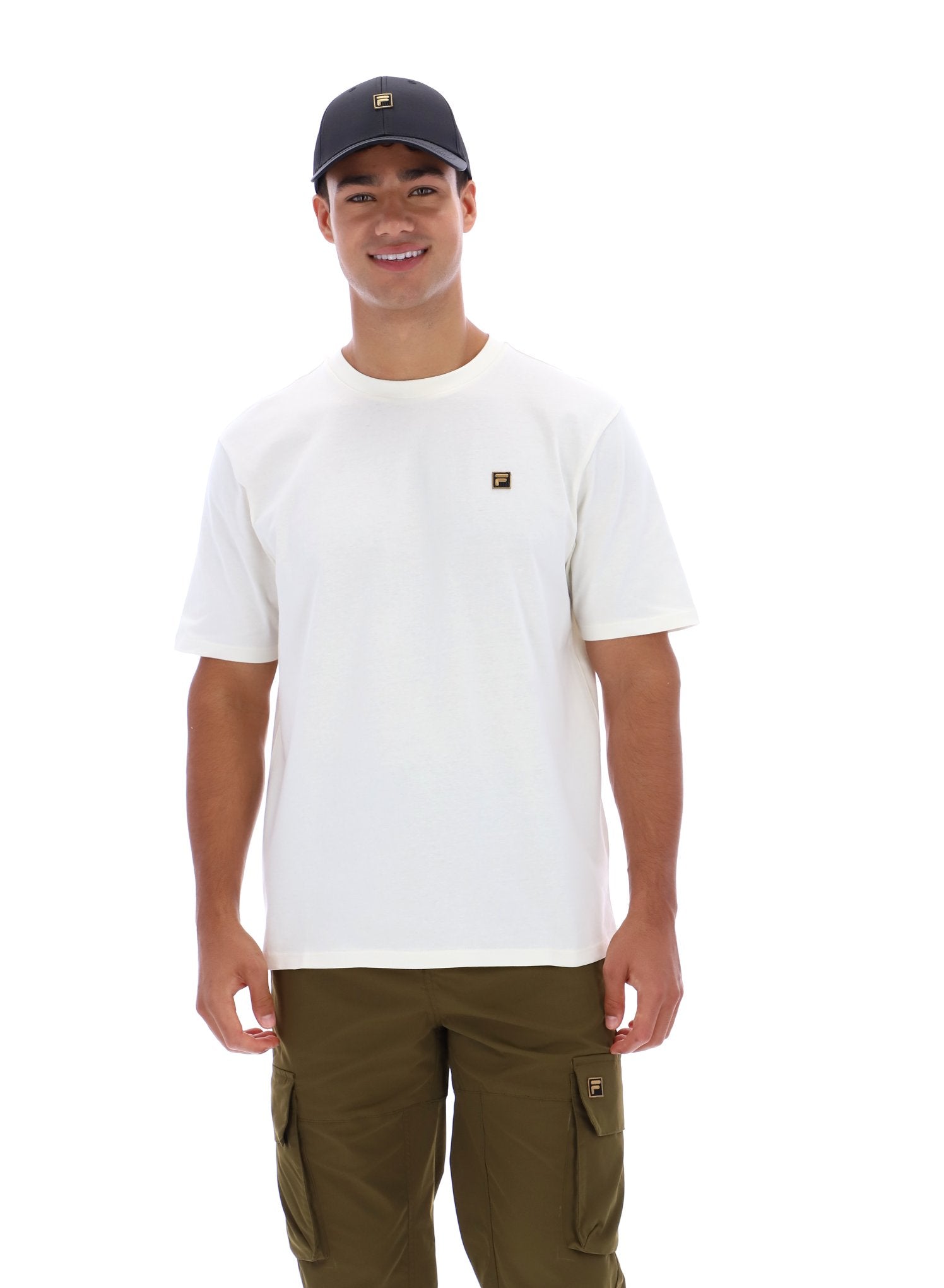 Man wearing white t-short, khaki trousers, and a black baseball cap on a white background