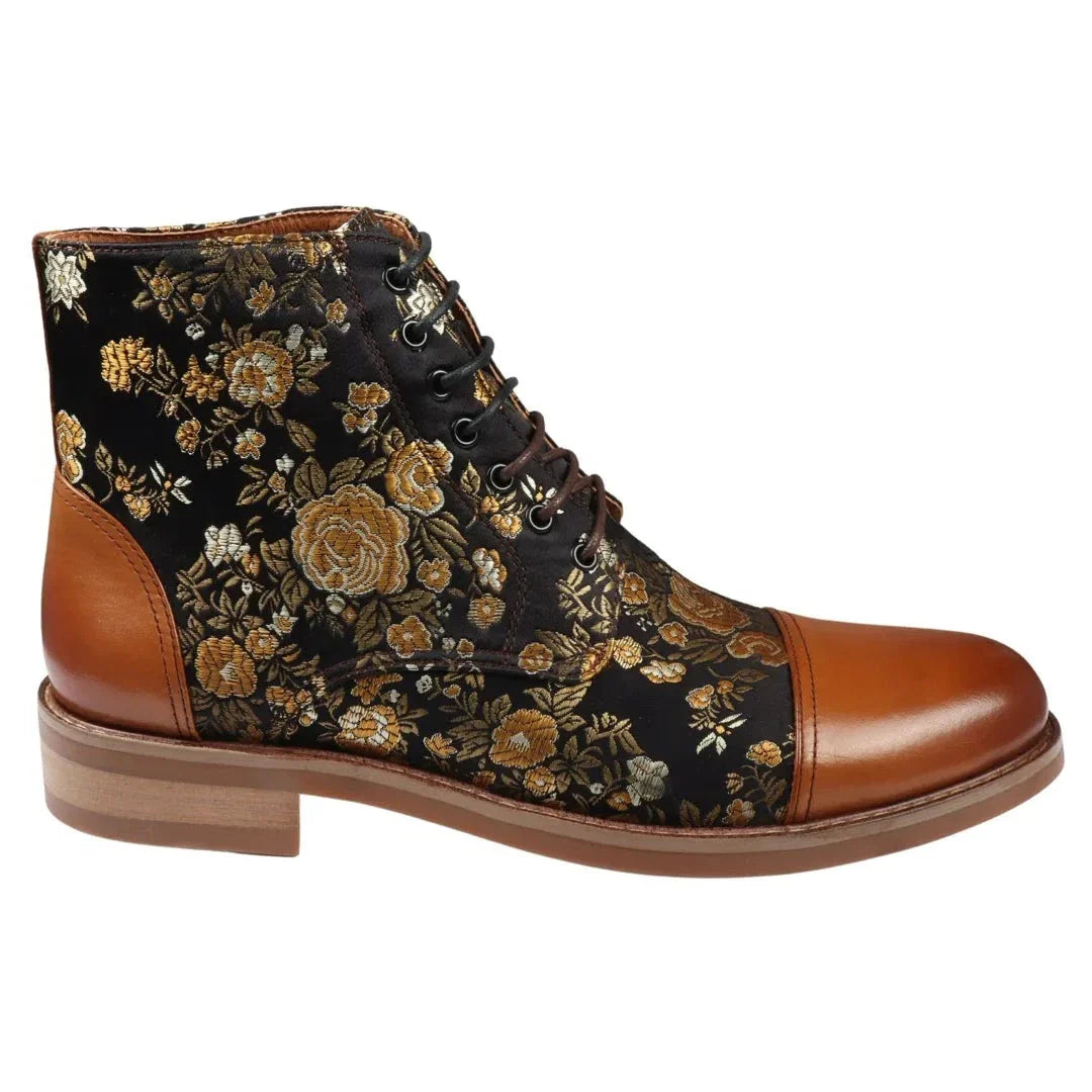 A pair of brown ankle boots with a floral print on the side and a lace-up closure.