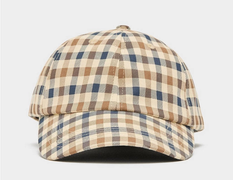 A beige, blue, and red checkered baseball cap with an adjustable strap.