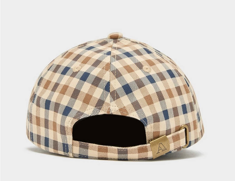 A beige, blue, and red checkered baseball cap with an adjustable strap.