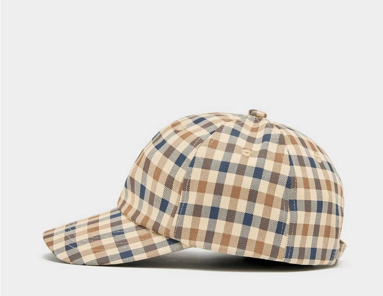 A beige, blue, and red checkered baseball cap with an adjustable strap.