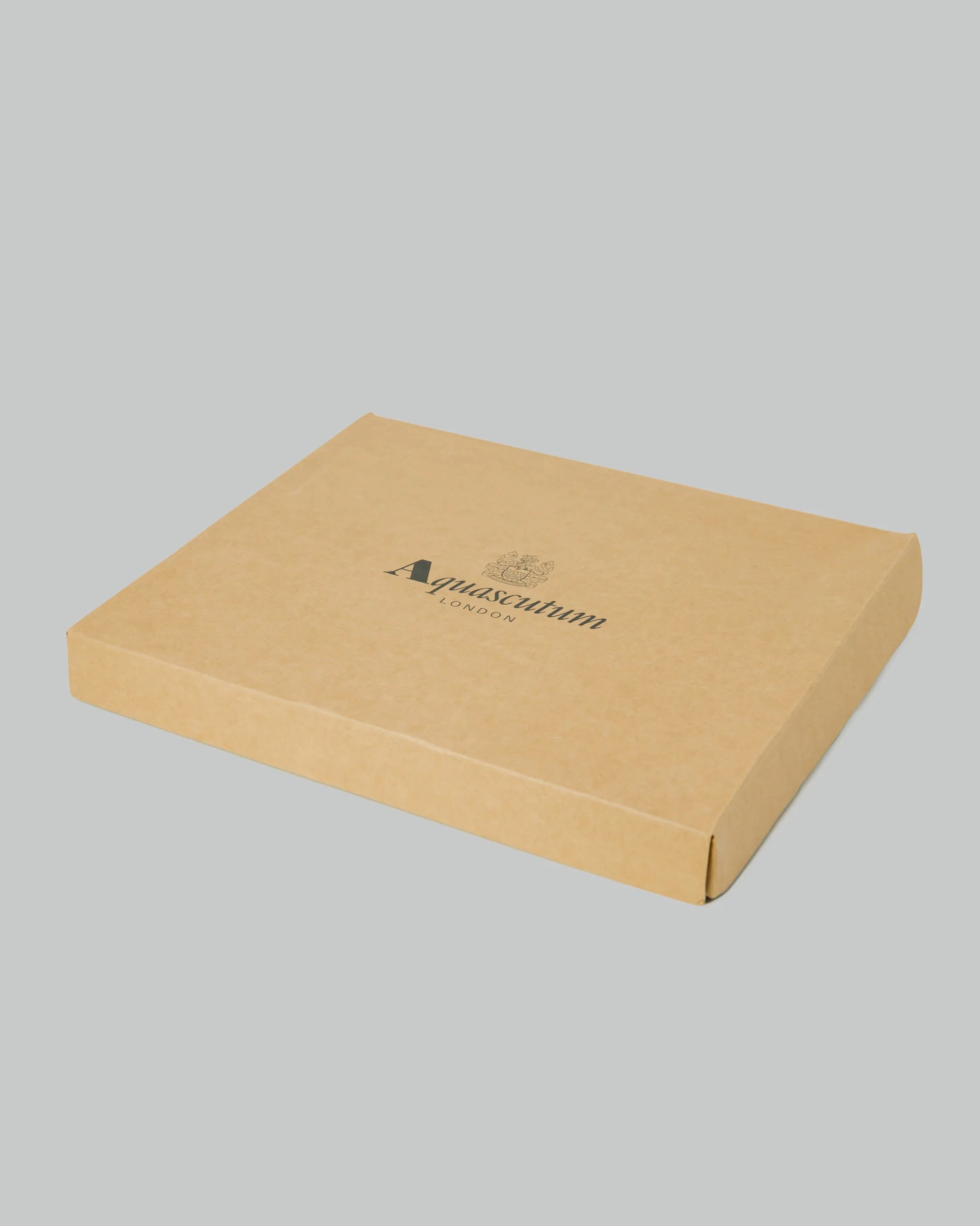 Scarf in a yellow box on a grey background