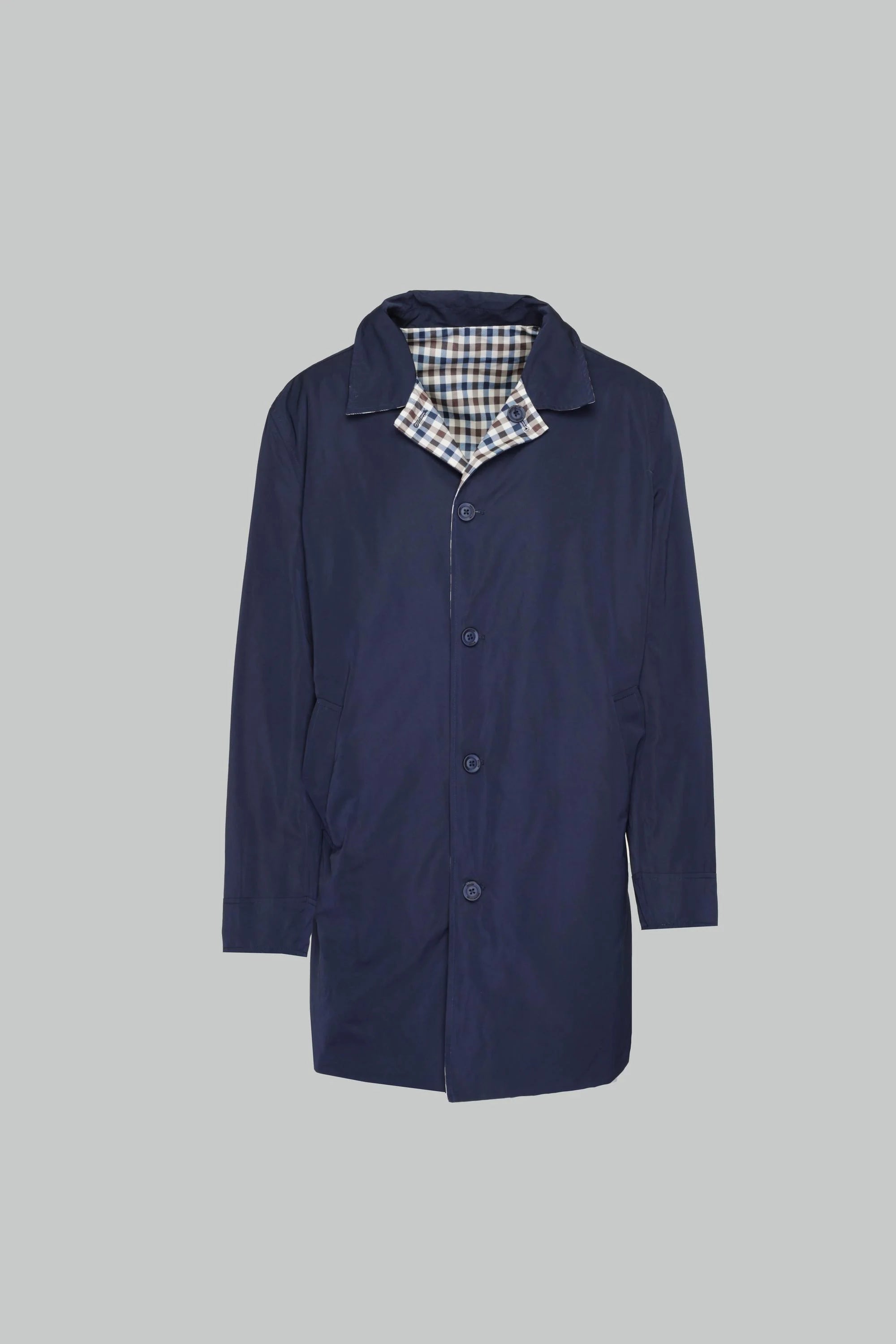 Blue coat on a grey background