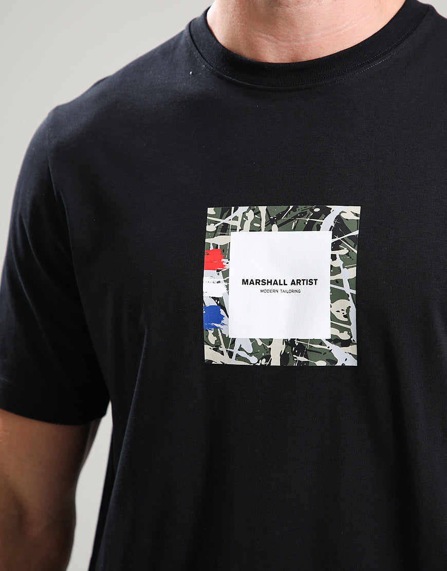 Black t-shirt with a colorful abstract design and 'Marshall Artist' text on a plain background