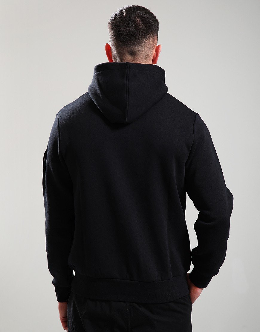 Person wearing a black hoodie from behind on a light gray background