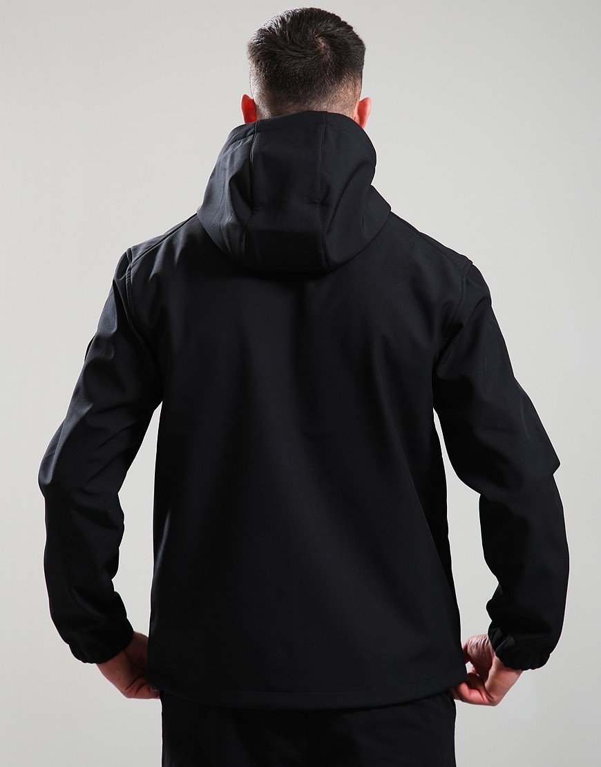 Person wearing a black jacket with a hood on a plain background