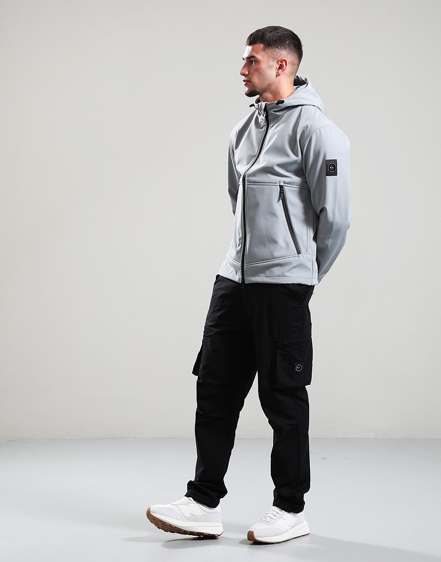 Man wearing a light gray hoodie and black cargo pants on a white background