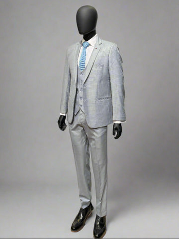 Gray suit with a white shirt and blue tie on a mannequin against a gray background