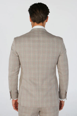 Man wearing a beige checkered suit on a white background