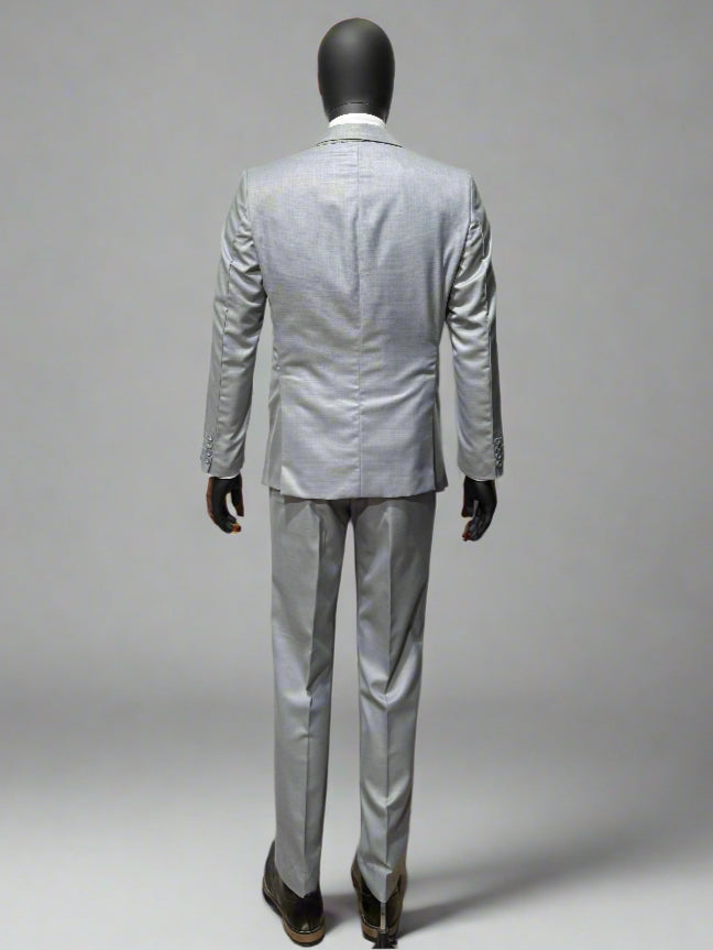 Mannequin wearing a light gray suit on a plain background